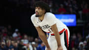 Oct 14, 2025; Portland, Oregon, USA; Portland Trail Blazers guard Shaedon Sharpe (17) looks up a the scoreboard during the first half against the Golden State Warriors at Moda Center. Mandatory Credit: Troy Wayrynen-Imagn Images