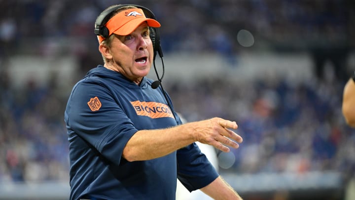 Aug 11, 2024; Indianapolis, Indiana, USA; Denver Broncos Head Coach Sean Payton shares a word with a referee during the second half against the Indianapolis Colts  at Lucas Oil Stadium. 