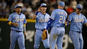 Texas Rangers first baseman Jake Burger (21) and his teammates celebrate the win over the Houston Astros at Globe Life Field.