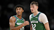 Oct 26, 2025; Dallas, Texas, USA; Dallas Mavericks guard Max Christie (00) talks with forward Cooper Flagg (32) during the second half against the Toronto Raptors at the American Airlines Center. Mandatory Credit: Jerome Miron-Imagn Images