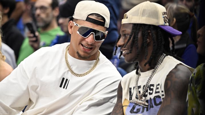 May 26, 2024; Dallas, Texas, USA; Kansas City Chiefs players Patrick Mahomes (left) and Hollywood Brown (right) look on in the first half between the Dallas Mavericks and the Minnesota Timberwolves during game three of the western conference finals for the 2024 NBA playoffs at American Airlines Center. Mandatory Credit: Jerome Miron-USA TODAY Sports