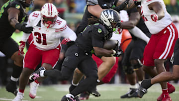 Oct 25, 2025; Eugene, Oregon, USA; Oregon Ducks running back Noah Whittington (6) carries the ball during the first half against the Wisconsin Badgers at Autzen Stadium. Mandatory Credit: Troy Wayrynen-Imagn Images