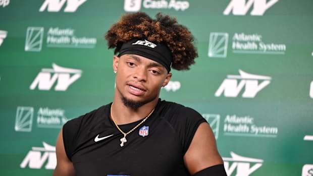 New York Jets quarterback Justin Fields (7) speaks at a press conference during minicamp