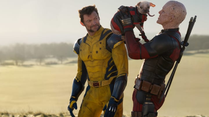 (L-R): Hugh Jackman as Wolverine/Logan, Dogpool, and Ryan Reynolds as Deadpool/Wade Wilson in 20th Century Studios/Marvel Studios' DEADPOOL & WOLVERINE. Photo by Jay Maidment. © 2024 20th Century Studios / © and ™ 2024 MARVEL.