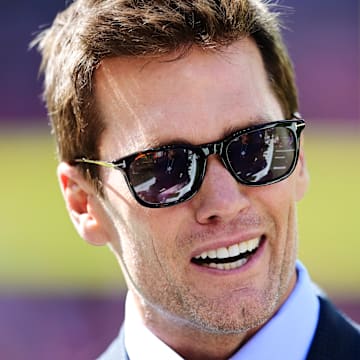 Sep 8, 2024; Cleveland, Ohio, USA; Fox Sports broadcaster Tom Brady talks on the field before the game between the Cleveland Browns and the Dallas Cowboys at Huntington Bank Field. 