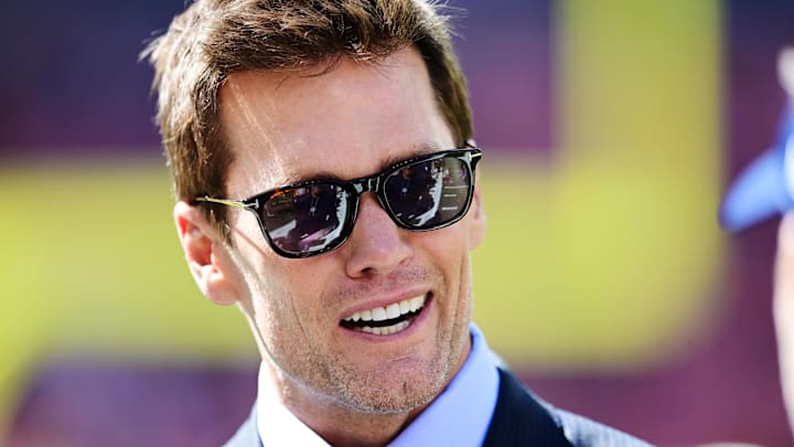 Sep 8, 2024; Cleveland, Ohio, USA; Fox Sports broadcaster Tom Brady talks on the field before the game between the Cleveland Browns and the Dallas Cowboys at Huntington Bank Field. 