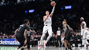 Jan 25, 2025; Brooklyn, New York, USA; Miami Heat guard Tyler Herro (14) drives to the basket while being defended by Brooklyn Nets guard Keon Johnson (45) during the first half at Barclays Center. Mandatory Credit: John Jones-Imagn Images