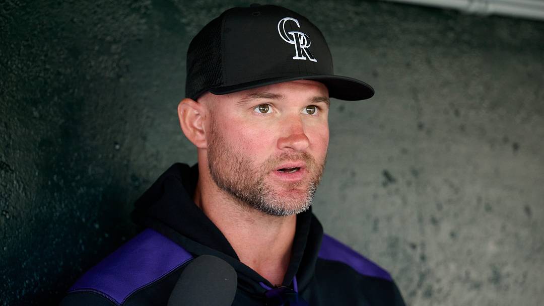 Rockies manager Warren Schaeffer (4) speaks to the media in the dugout Rockies manager Warren Schaeffer (4) speaks to the media in the dugout
