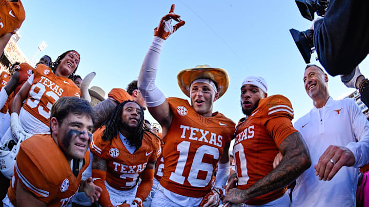 Texas defensive back Michael Taaffe celebrates with the golden hat after beating Oklahoma.