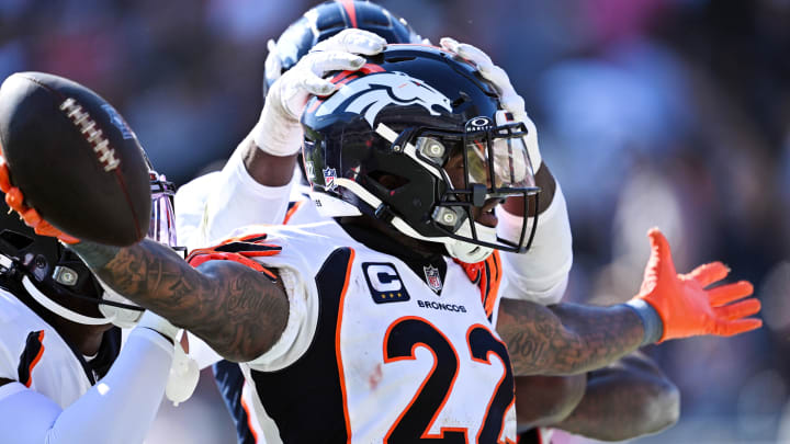 Oct 1, 2023; Chicago, Illinois, USA;  Denver Broncos safety Kareem Jackson (22) celebrates after intercepting a Chicago Bears pass in the fourth quarter at Soldier Field. Mandatory Credit: Jamie Sabau-USA TODAY Sports