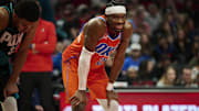 Nov 30, 2025; Portland, Oregon, USA; Oklahoma City Thunder guard Shai Gilgeous-Alexander (2) smiles at a fan during the second half in a game against the Portland Trail Blazers at Moda Center. Mandatory Credit: Troy Wayrynen-Imagn Images