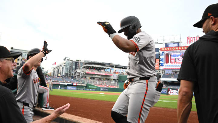 Aug 6, 2024; Washington, District of Columbia, USA; San Francisco Giants center fielder Heliot Ramos (17) celebrates as he walks into the dugout after hitting a home run against the Washington Nationals during the first inning at Nationals Park.