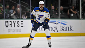 Dec 14, 2024; Dallas, Texas, USA; St. Louis Blues defenseman Pierre-Olivier Joseph (77) in action during the game between the Dallas Stars and the St. Louis Blues at American Airlines Center. Mandatory Credit: Jerome Miron-Imagn Images