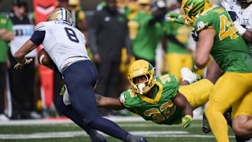 Aug 30, 2025; Eugene, Oregon, USA; Oregon Ducks linebacker Nasir Wyatt (32) leaps for a tackle during the second half against Montana State Bobcats quarterback Justin Lamson (8) at Autzen Stadium. Mandatory Credit: Troy Wayrynen-Imagn Images