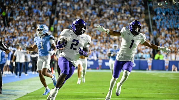 TCU Horned Frogs running back Kevorian Barnes (2) scores a touchdown as safety Austin Jordan (1) celebrates and North Carolin
