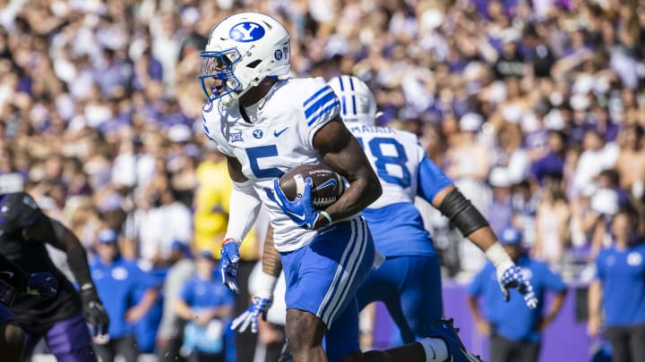 Oct 14, 2023; Fort Worth, Texas, USA; Brigham Young Cougars wide receiver Darius Lassiter (5) runs with the ball against the TCU Horned Frogs during the game at Amon G. Carter Stadium. Mandatory Credit: Jerome Miron-USA TODAY Sports