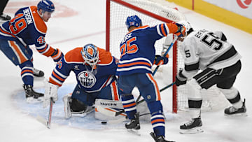 Apr 14, 2025; Edmonton, Alberta, CAN; Edmonton Oilers goalie Calvin Pickard (30) looks for the puck with defenseman DArnell Nurse (25) against Los Angeles Kings right wing Quinton Byfield (5) during the second period at Rogers Place. Mandatory Credit: Walter Tychnowicz-Imagn Images