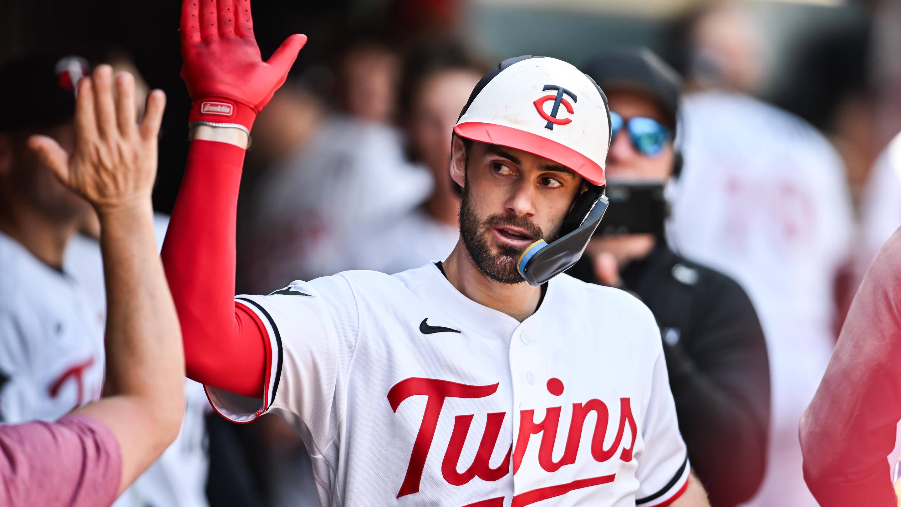Jun 28, 2026; Minneapolis, Minnesota, USA; Minnesota Twins shortstop Ryan Kreidler (5) reacts with teammates after hitting a home run during the seventh inning against the Colorado Rockies at Target Field.