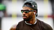 Cleveland Browns quarterback Shedeur Sanders (12) warms up before the game against the San Francisco 49ers at Huntington Bank Field.