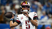 Washington Commanders quarterback Jayden Daniels (5) warms up prior to the game against Detroit Lions in a 2025 NFC divisional round game at Ford Field. 