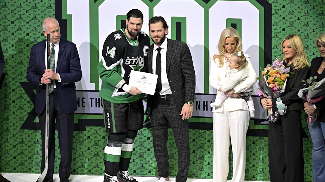 Dec 13, 2025; Dallas, Texas, USA; Dallas Stars left wing Jamie Benn (14) poses with center Tyler Seguin (91) during a ceremony honoring Seguin for playing in his 1,000 game before the game between the Stars and the Florida Panthers at the American Airlines Center. Mandatory Credit: Jerome Miron-Imagn Images