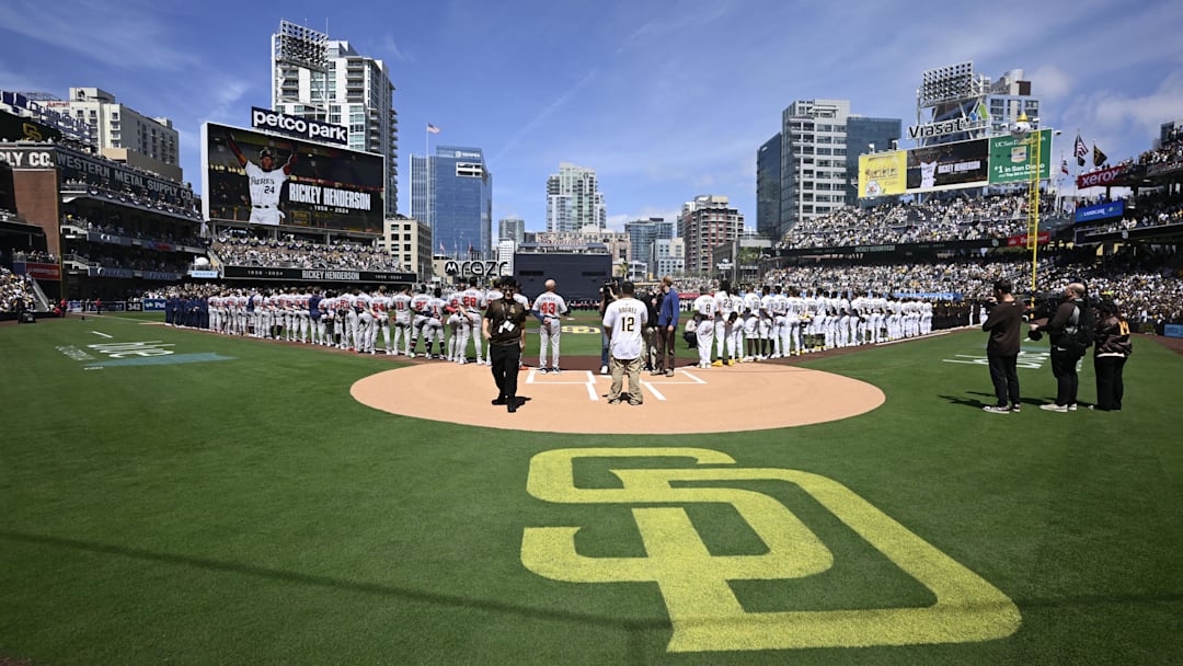 San Diego Padres players stand on the field during the national anthem before a baseball game against the Atlanta Braves at Petco Park on March 27.