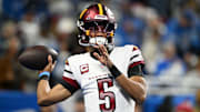 Jan 18, 2025; Detroit, Michigan, USA; Washington Commanders quarterback Jayden Daniels (5) warms up prior to the game against Detroit Lions in a 2025 NFC divisional round game at Ford Field. Mandatory Credit: Lon Horwedel-Imagn Images
