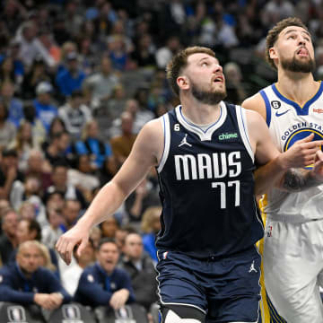 Mar 22, 2023; Dallas, Texas, USA; Dallas Mavericks guard Luka Doncic (77) and Golden State Warriors guard Klay Thompson (11) in action during the game between the Dallas Mavericks and the Golden State Warriors at the American Airlines Center. Mandatory Credit: Jerome Miron-USA TODAY Sports