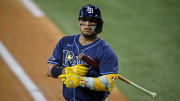 Jul 6, 2024; Arlington, Texas, USA; Tampa Bay Rays third baseman Isaac Paredes (17) adjusts his glove as he bats against the Texas Rangers during the first inning at Globe Life Field.