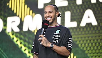 Oct 19, 2024; Austin, Texas, USA; Mercedes AMG Petronas F1 Team driver Lewis Hamilton (44) of Team Great Britain smiles to the crowd during a fan forum before the Sprint Race in the 2024 Formula One US Grand Prix at Circuit of the Americas. Mandatory Credit: Jerome Miron-Imagn Images