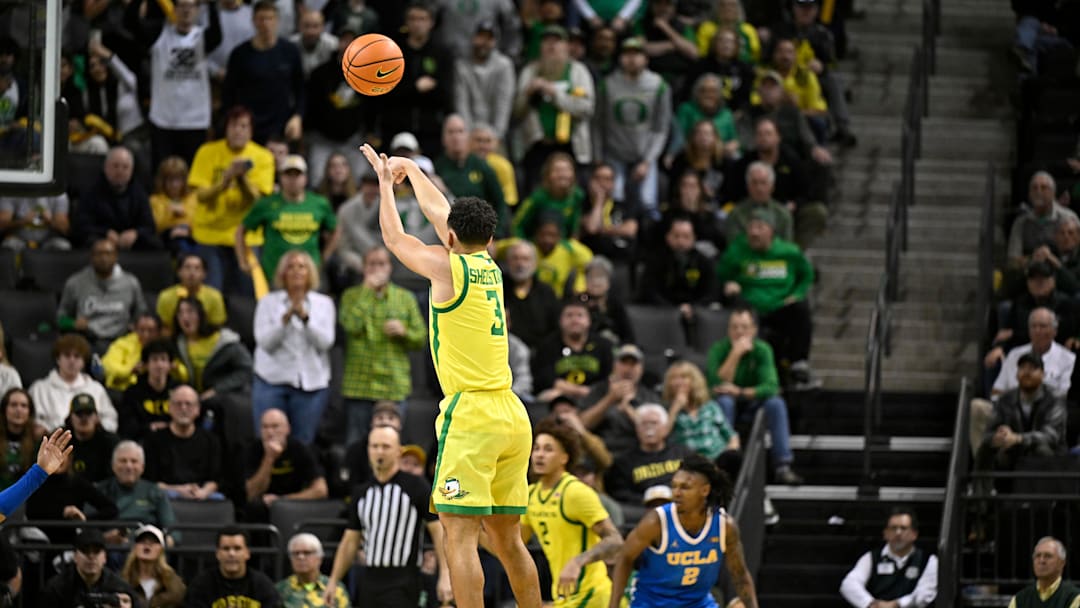 Dec 8, 2024; Eugene, Oregon, USA; Oregon Ducks guard Jackson Shelstad (3) shoots a three-point shot in the second half against the UCLA Bruins.