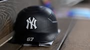 Aug 4, 2025; Arlington, Texas, USA; A view of a New York Yankees helmet and logo before the game between the Texas Rangers and the New York Yankees at Globe Life Field. Mandatory Credit: Jerome Miron-Imagn Images