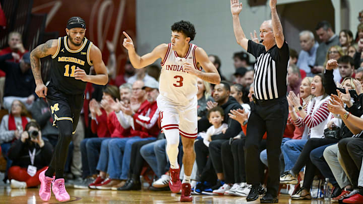 Feb 8, 2025; Bloomington, Indiana, USA; Indiana Hoosiers guard Anthony Leal (3) celebrates after a play in front of Michigan Wolverines guard Roddy Gayle Jr. (11) during the second half at Simon Skjodt Assembly Hall. Mandatory Credit: Robert Goddin-Imagn Images