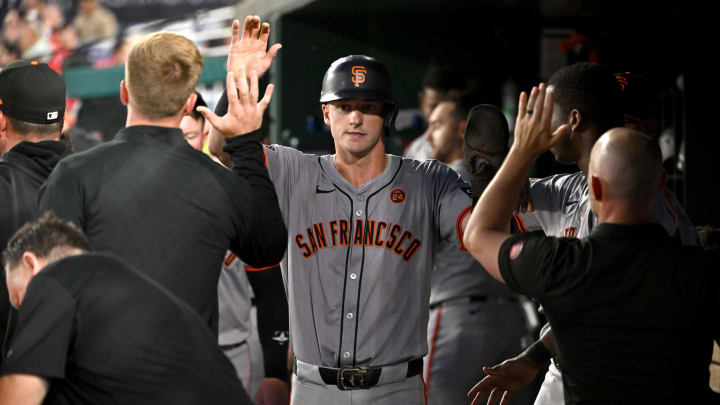 Aug 6, 2024; Washington, District of Columbia, USA; San Francisco Giants center fielder Tyler Fitzgerald celebrates in the dugout.