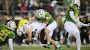 Nov 14, 2025; Eugene, Oregon, USA; Minnesota Golden Gophers tight end Jameson Geers (86) loses control of the ball during the first half against Oregon Ducks defensive back Dillon Thieneman (31) at Autzen Stadium. Mandatory Credit: Troy Wayrynen-Imagn Images