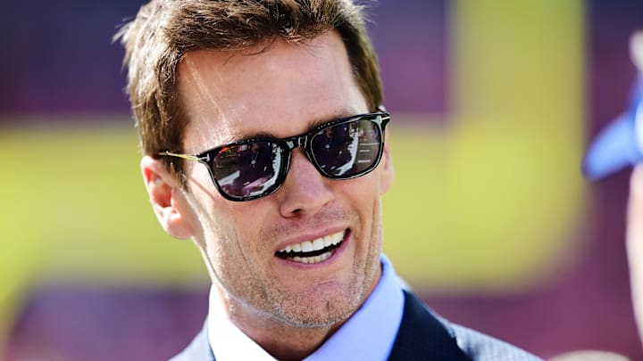 Sep 8, 2024; Cleveland, Ohio, USA; Fox Sports broadcaster Tom Brady talks on the field before the game between the Cleveland Browns and the Dallas Cowboys at Huntington Bank Field.