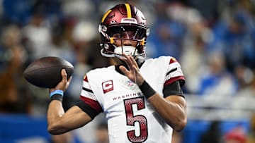 Jan 18, 2025; Detroit, Michigan, USA; Washington Commanders quarterback Jayden Daniels (5) warms up prior to the game against Detroit Lions in a 2025 NFC divisional round game at Ford Field. Mandatory Credit: Lon Horwedel-Imagn Images