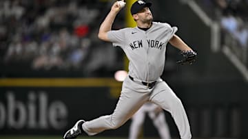 Aug 4, 2025; Arlington, Texas, USA; New York Yankees relief pitcher Jake Bird (59) pitches against the Texas Rangers during the tenth inning at Globe Life Field. Mandatory Credit: Jerome Miron-Imagn Images