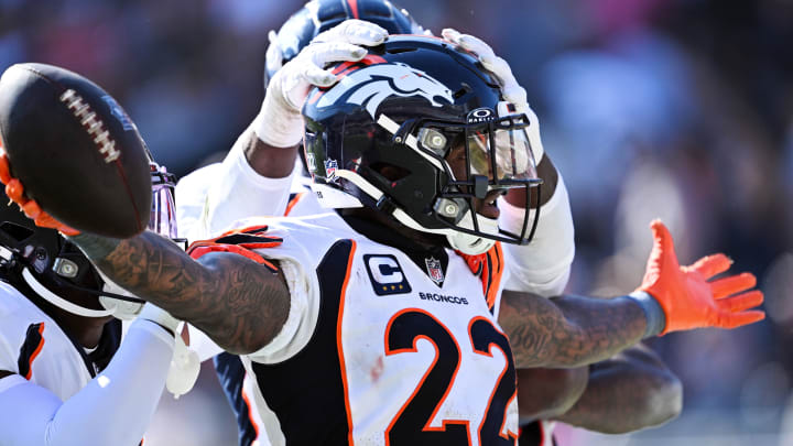 Oct 1, 2023; Chicago, Illinois, USA;  Denver Broncos safety Kareem Jackson (22) celebrates after intercepting a Chicago Bears pass in the fourth quarter at Soldier Field. Mandatory Credit: Jamie Sabau-USA TODAY Sports