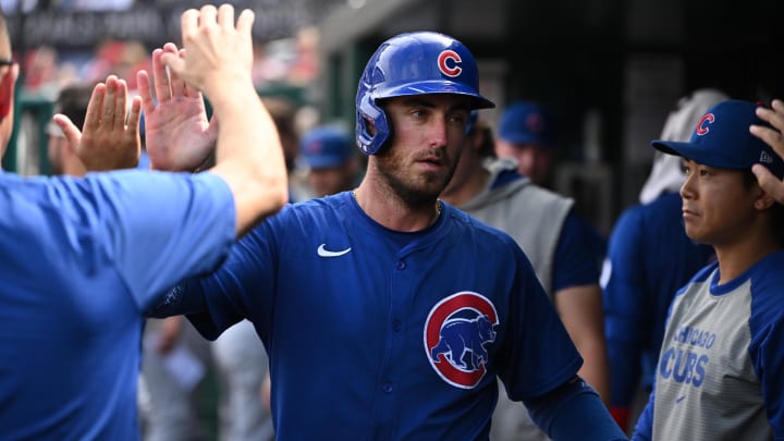 Sep 1, 2024; Washington, District of Columbia, USA; Chicago Cubs center fielder Cody Bellinger (24) celebrates in the dugout after scoring a run against the Washington Nationals during the seventh inning at Nationals Park.