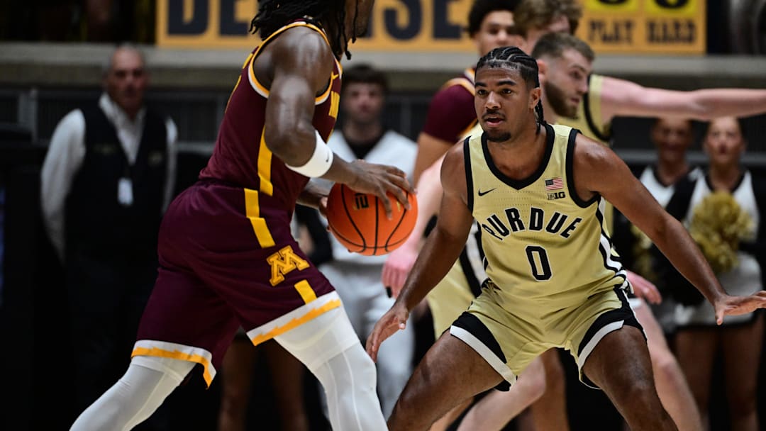Purdue Boilermakers guard C.J. Cox (0) defends against Minnesota Golden Gophers guard Langston Reynolds (6)