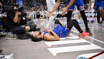 Nov 27, 2024; Dallas, Texas, USA; New York Knicks guard Jalen Brunson (11) falls to the floor during the second half of the game against the Dallas Mavericks at the American Airlines Center. Mandatory Credit: Jerome Miron-Imagn Images