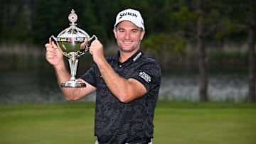 Ryan Fox poses with the winner's trophy following his victory at the 2025 RBC Canadian Open at TPC Toronto