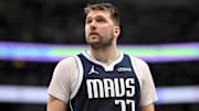 Dec 23, 2024; Dallas, Texas, USA; Dallas Mavericks guard Luka Doncic (77) checks the scoreboard during the second half against the Portland Trail Blazers at the American Airlines Center. Mandatory Credit: Jerome Miron-Imagn Images