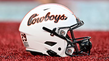 Nov 18, 2023; Houston, Texas, USA; A detailed view of an Oklahoma State Cowboys helmet on the sideline of the game against the Houston Cougars at TDECU Stadium. Mandatory Credit: Maria Lysaker-Imagn Images