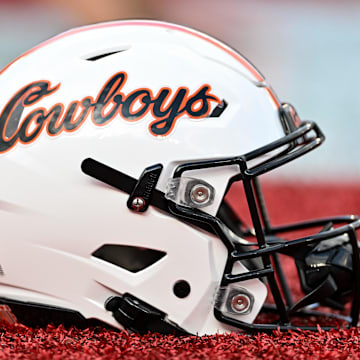 Nov 18, 2023; Houston, Texas, USA; A detailed view of an Oklahoma State Cowboys helmet on the sideline of the game against the Houston Cougars at TDECU Stadium. Mandatory Credit: Maria Lysaker-Imagn Images