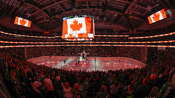 A view of the Canadian flag during the playing of the national anthem of Canada before a hockey game.