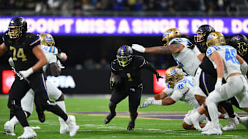 Nov 15, 2024; Seattle, Washington, USA; Washington Huskies running back Jonah Coleman (1) carries the ball against the UCLA Bruins during the second half at Alaska Airlines Field at Husky Stadium. Mandatory Credit: Steven Bisig-Imagn Images