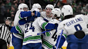 Apr 8, 2025; Dallas, Texas, USA; Vancouver Canucks left wing Jake DeBrusk (74) and center Pius Suter (24) and right wing Brock Boeser (6) and right wing Conor Garland (8) and defenseman Filip Hronek (17) and defenseman Quinn Hughes (43) celebrates the game tying goal scored by Suter against the Dallas Stars during the third period at the American Airlines Center. Mandatory Credit: Jerome Miron-Imagn Images