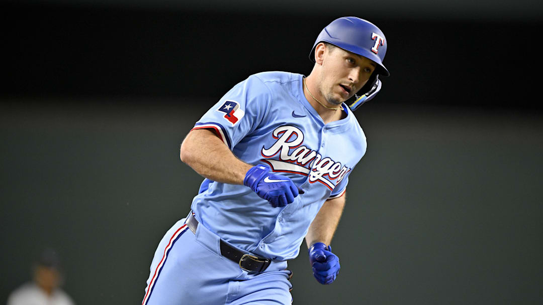 Sep 21, 2025; Arlington, Texas, USA; Texas Rangers left fielder Wyatt Langford (36) rounds the bases after he hits a home run against the Miami Marlins during the sixth inning at Globe Life Field. Mandatory Credit: Jerome Miron-Imagn Images